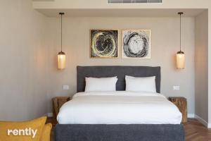 Luxury Apartments And Studios At Sea Side By Rently客房内的一张或多张床位