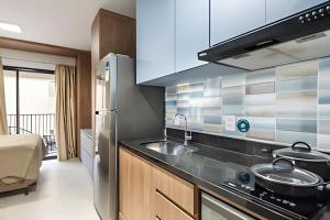 Kuchyň nebo kuchyňský kout v ubytování Kaza Noah Facto Paulista Bela Vista