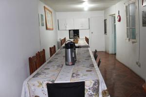 a kitchen with a table with a tea kettle on it at El valle in Copiapó
