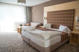 Giường trong phòng chung tại Boutique Hotel Erla