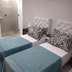Postel nebo postele na pokoji v ubytování Rosa Ramona Rooms