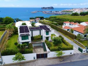 an aerial view of a house with the ocean in the background at Exceptional villa in Vila Franca Do Campo with private pool in Vila Franca do Campo