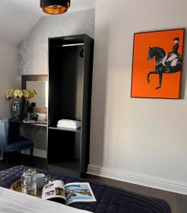 a room with a picture of a horse on the wall at Allerton Loft - Beautiful peaceful apartment in Liverpool +5 photos