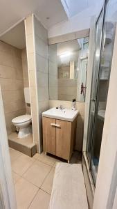 a bathroom with a sink and a toilet at Sweet Alfama, Apartment 2 in Lisbon