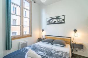 Una cama o camas en una habitación de Le Cocon Coloré