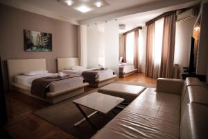 Llit o llits en una habitació de Garni Uni Elita Lux Hotel