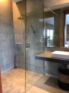 a bathroom with a shower and a sink at The balangan studio room 3mins to balangan beach in Uluwatu