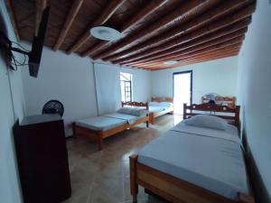 Ένα ή περισσότερα κρεβάτια σε δωμάτιο στο Quinta el Acuario