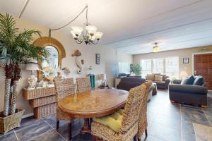 a dining room with a table and chairs at Beachview Condominiums #111 in South Padre Island