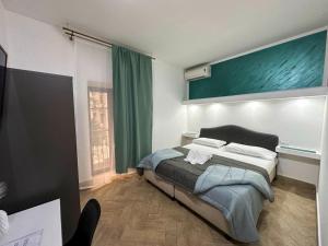 Postel nebo postele na pokoji v ubytování Hotel Barbato