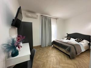 Postel nebo postele na pokoji v ubytování Hotel Barbato