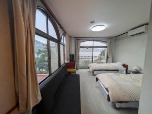 Postel nebo postele na pokoji v ubytování プチホテル　MASUYA