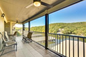 a balcony with chairs and a view of the water at Waterfront Lazy Days Condo with Views and Pool Access! in Osage Beach