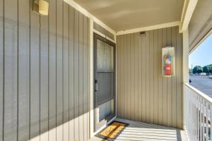 a front porch of a house with a fire hydrant at Waterfront Lazy Days Condo with Views and Pool Access! in Osage Beach
