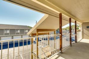 a balcony with a view of a pool at Waterfront Lazy Days Condo with Views and Pool Access! in Osage Beach