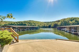 a river with a bunch of boats on the water at Waterfront Lazy Days Condo with Views and Pool Access! in Osage Beach