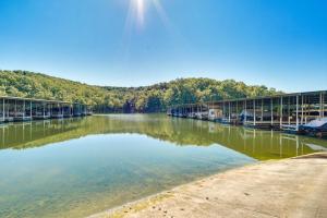 a large body of water with a bridge at Waterfront Lazy Days Condo with Views and Pool Access! in Osage Beach