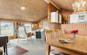 a kitchen and dining room with a table and chairs at Pet Friendly Home In Thisted With Sauna in Thisted