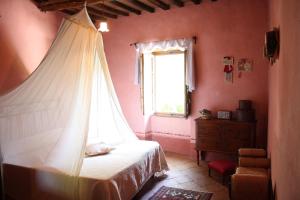 Postel nebo postele na pokoji v ubytování La Locanda del Loggiato