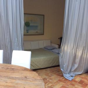 Postel nebo postele na pokoji v ubytování La casa nella Macchia