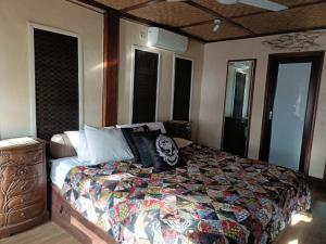 Postel nebo postele na pokoji v ubytování Lombok Sunset Hideaway