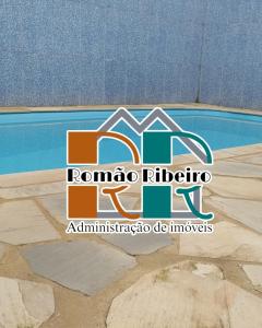 un logo pour le logo roma riftico dans l'établissement Casa Temporada em Ubatuba Piscina, à Ubatuba
