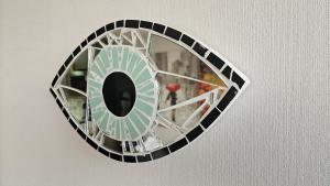 a clock on a wall with a mirror on it at Best Apartment Rental Estación Central in Santiago