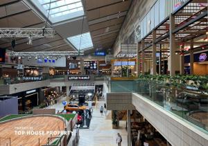 a view of a shopping mall with people in it at 2 Bed Casa Grande Mall Kota Kasablanka By Travelibu in Jakarta