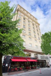 a large building with a store in front of it at Avantgarde Hotel Taksim in Istanbul