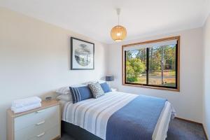 Postel nebo postele na pokoji v ubytování Palm Top Vincentia - Walk to beach. Wi-Fi & Linen