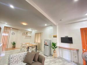 a living room with a couch and a table at RHM homestay in Naga