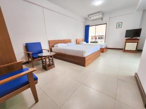 Postel nebo postele na pokoji v ubytování Siam Palace Hotel