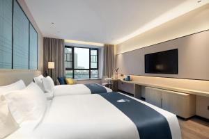 Foto sihtkohas Huangxing asuva majutusasutuse Echarm Hotel Changsha Huangxing Avenue Airport Store galeriist