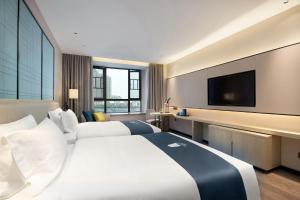 Foto sihtkohas Huangxing asuva majutusasutuse Echarm Hotel Changsha Huangxing Avenue Airport Store galeriist