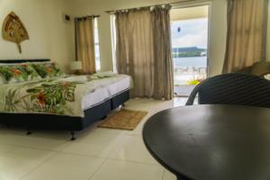Wolfgramm Beachfront Motel客房内的一张或多张床位