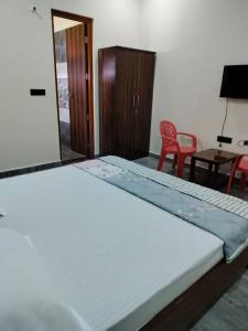 Giường trong phòng chung tại Blue Bell Villa Corbett City Ramnagar