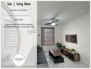 a living room with a ceiling fan and a table at Loft Joe con WiFi y Alberca in Tulum