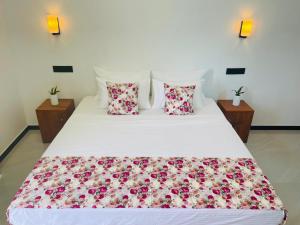 Postel nebo postele na pokoji v ubytování Randon Resort Mirissa