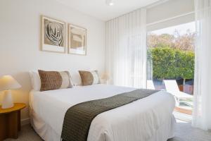 En eller flere senge i et værelse på Sandy Shores + 21 billeder