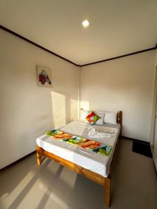 Postel nebo postele na pokoji v ubytování Brenmariel Tourist Inn