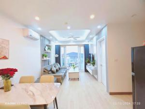 a living room with a couch and a table at Homestay newlife Hạ Long in Ha Long