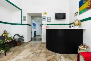 TV a/nebo společenská místnost v ubytování B&B La Pineta