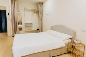 Ένα ή περισσότερα κρεβάτια σε δωμάτιο στο The Butter Homestay