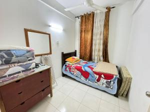 Postel nebo postele na pokoji v ubytování Residence Homestay wakaf Che Yeh