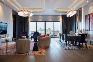 a living room with chandeliers and a lobby at KARAVANSARAY Turkistan Family Hotel - FLYING THEATRE ACCESS in Türkistan