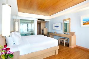 Ein Bett oder Betten in einem Zimmer der Unterkunft Beyond Karon