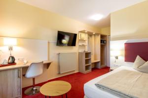 TV a/nebo společenská místnost v ubytování Hotel Montana