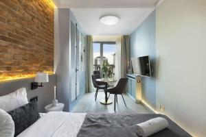 Ένα ή περισσότερα κρεβάτια σε δωμάτιο στο Elite Apartments Granaria Luxury Studio