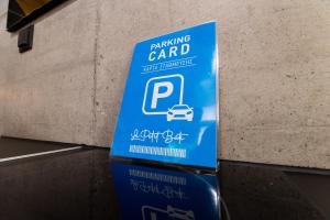 a sign for a car parked next to a wall at Luxury - Le petit Bati in Volos