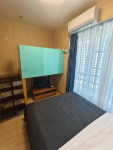 Postel nebo postele na pokoji v ubytování 上海加特奈斯新时空酒店中山公园店